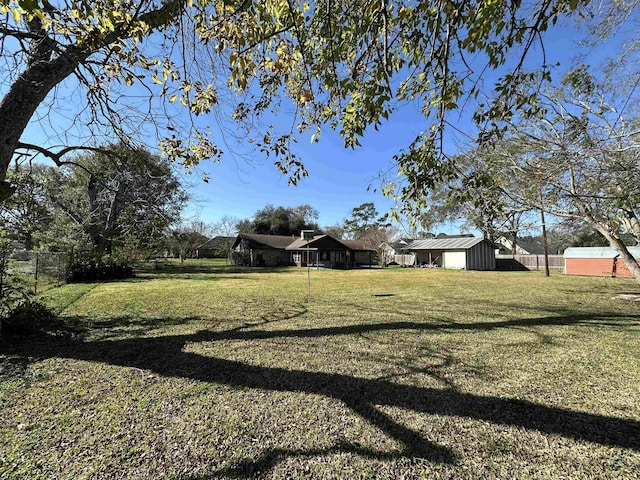 view of yard with an outdoor structure