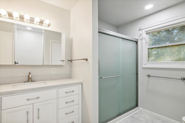 bathroom with vanity and walk in shower