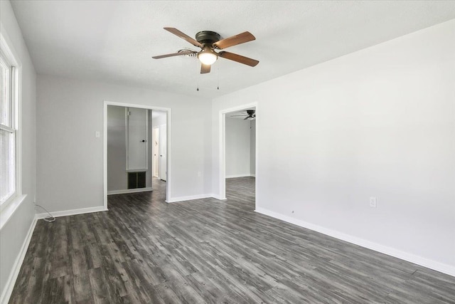 unfurnished room featuring dark hardwood / wood-style flooring