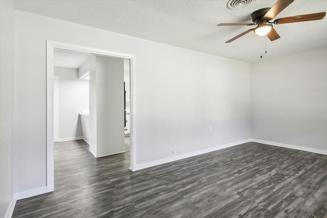 unfurnished room with a textured ceiling, ceiling fan, and dark wood-type flooring