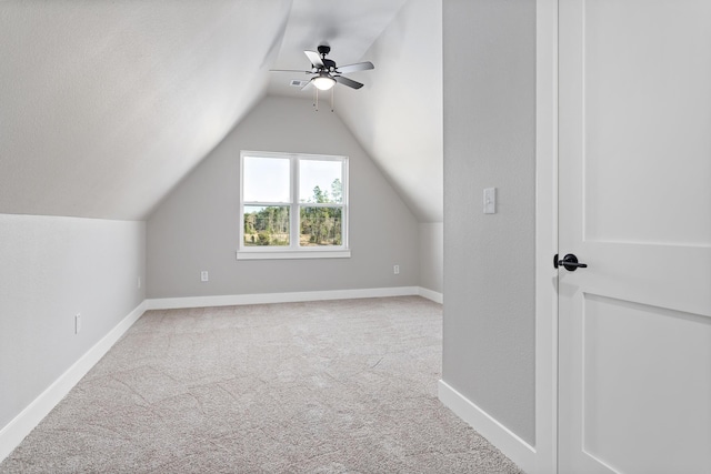 bonus room featuring ceiling fan, carpet floors, and lofted ceiling