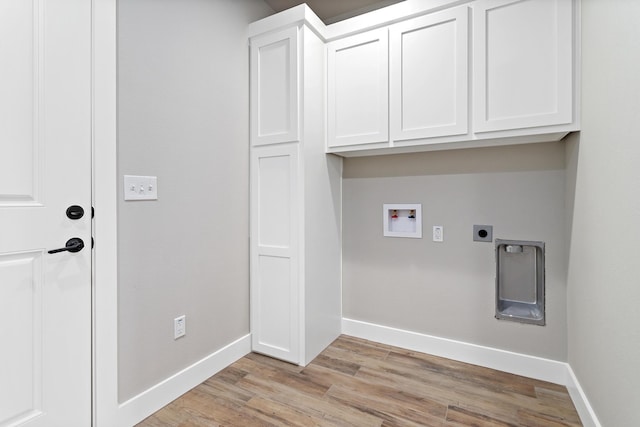 laundry area with electric dryer hookup, cabinets, light wood-type flooring, and hookup for a washing machine