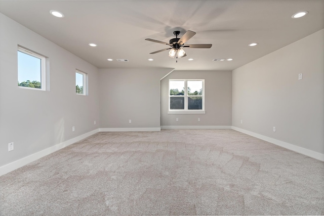 empty room with light carpet and ceiling fan