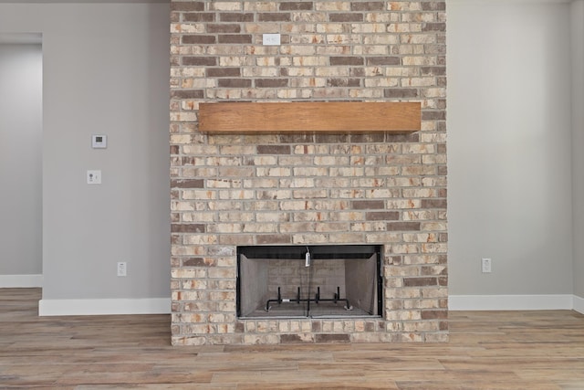 interior details with a fireplace and hardwood / wood-style floors