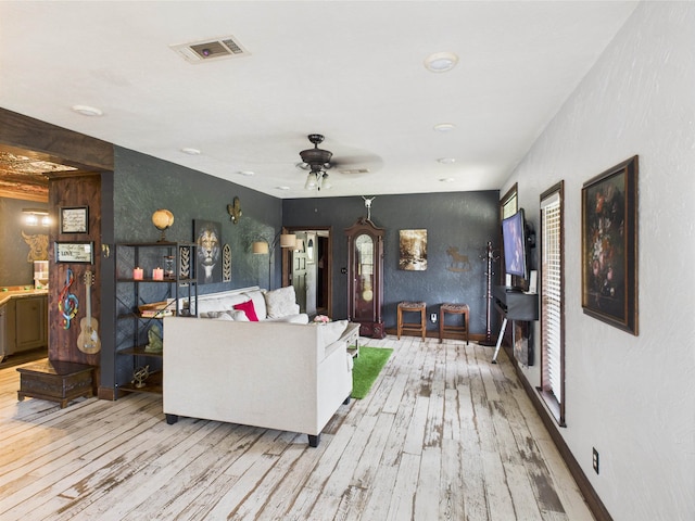 650 Sudduth Dr, Bridge City, TX 77611 - living room featuring light wood finished floors, ceiling fan, and healthy amount of natural light