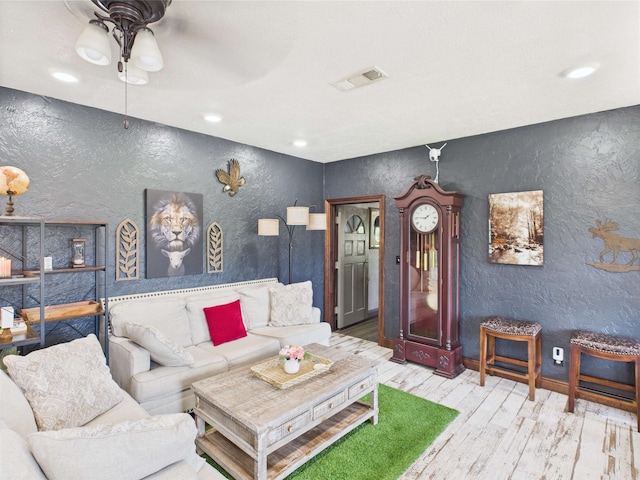 650 Sudduth Dr, Bridge City, TX 77611 - living area featuring a textured wall, wood finished floors, ceiling fan, recessed lighting, and baseboards