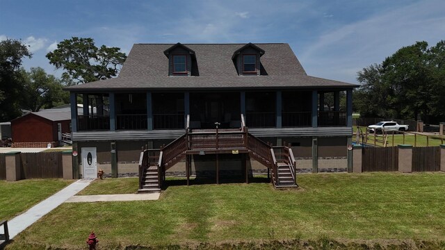 650 Sudduth Dr, Bridge City, TX 77611 - rear view of property with a sunroom, stairway, and a shingled roof