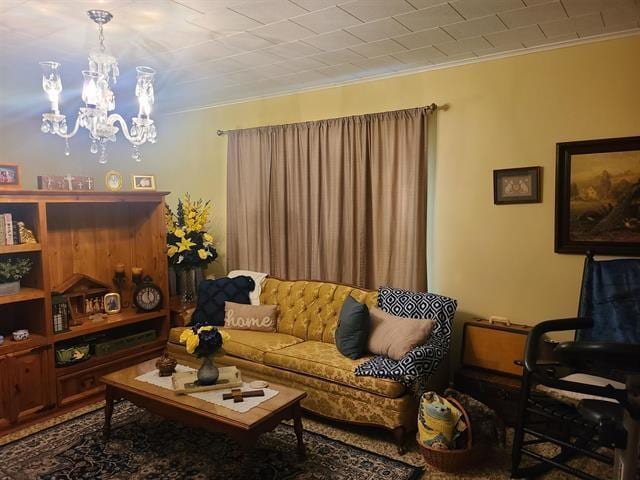 living room featuring ornamental molding and a chandelier