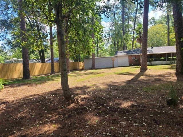 view of yard featuring a sunroom