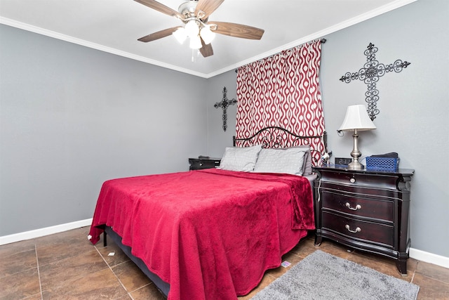 bedroom featuring a ceiling fan, baseboards, and crown molding