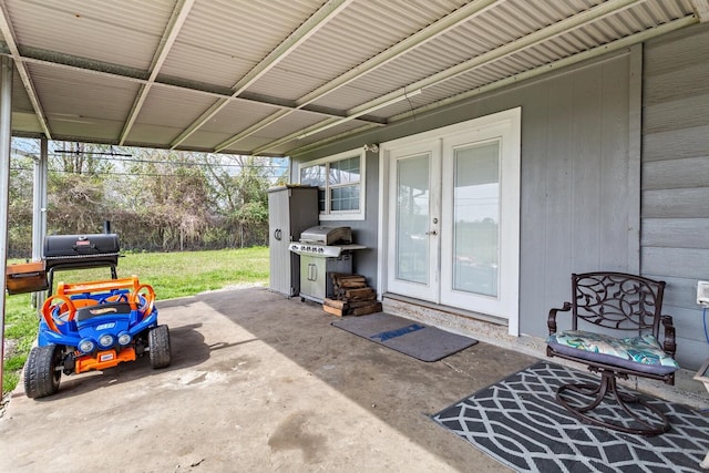 view of patio with a carport, french doors, and area for grilling