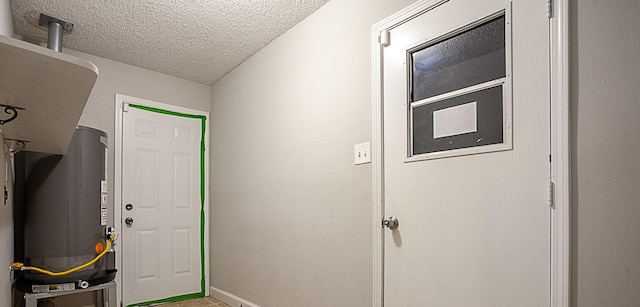 interior space with a textured ceiling