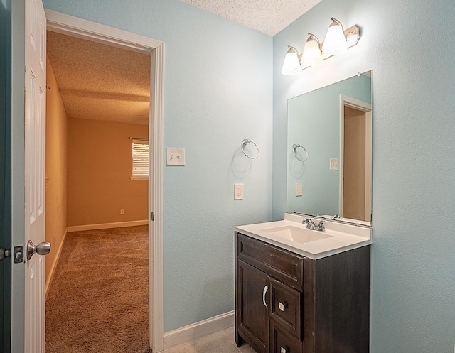 bathroom featuring vanity and a textured ceiling