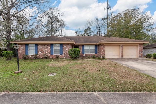 ranch-style home featuring a front lawn and a garage