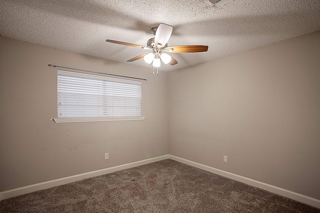 carpeted spare room featuring a textured ceiling and ceiling fan