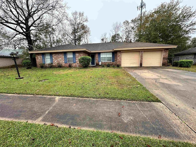 ranch-style house featuring a garage and a front lawn