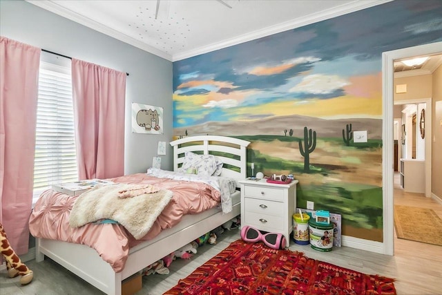 bedroom with crown molding, ceiling fan, and wood-type flooring