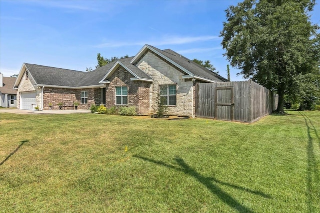 view of front of house with a garage and a front yard