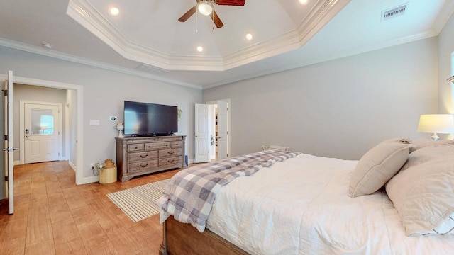108 Colonial Estates Dr, Bridge City, TX 77611 - bedroom featuring a tray ceiling, light wood-type flooring, ornamental molding, baseboards, and ceiling fan