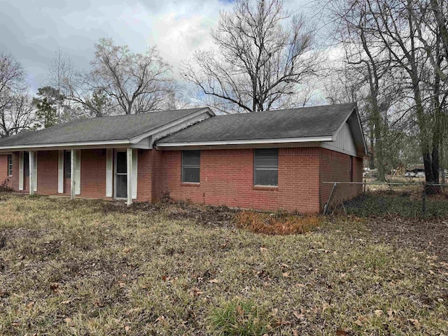 ranch-style house with a front lawn