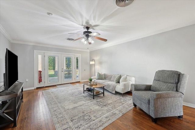 980 N 23rd St, Beaumont, TX 77706 - living area featuring wood finished floors, french doors, baseboards, ceiling fan, and ornamental molding