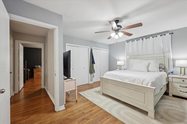 980 N 23rd St, Beaumont, TX 77706 - bedroom with multiple closets, light wood-type flooring, and a ceiling fan