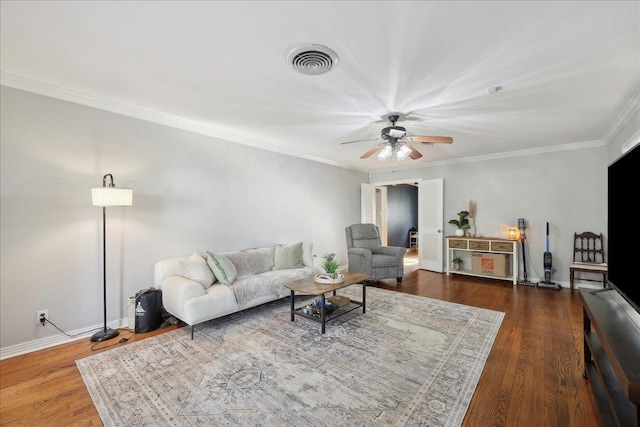 980 N 23rd St, Beaumont, TX 77706 - living room with ceiling fan, dark wood-style flooring, ornamental molding, and baseboards