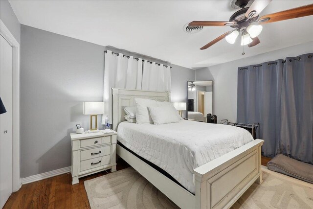 980 N 23rd St, Beaumont, TX 77706 - bedroom with baseboards, wood finished floors, and a ceiling fan