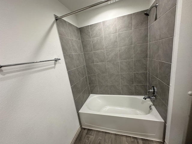 1525 Holly Trl, Sour Lake, TX 77659 - bathroom with wood finished floors and shower / bathtub combination