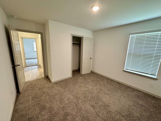 1525 Holly Trl, Sour Lake, TX 77659 - unfurnished bedroom with carpet floors and a closet