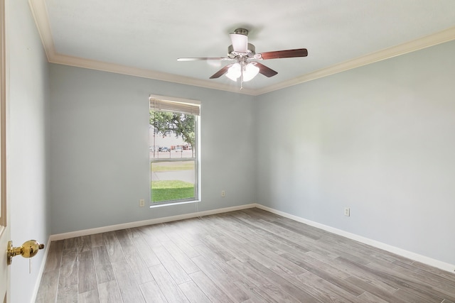 empty room with crown molding, ceiling fan, and light hardwood / wood-style flooring