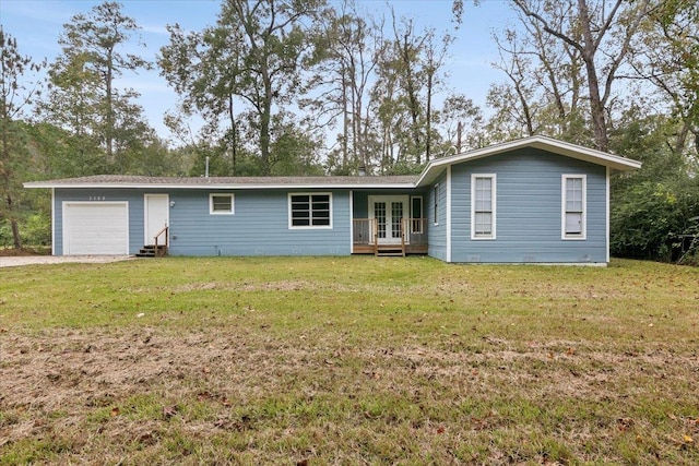 single story home with french doors and a front yard