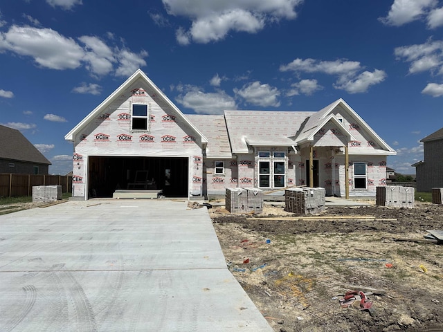 unfinished property with central AC and a garage