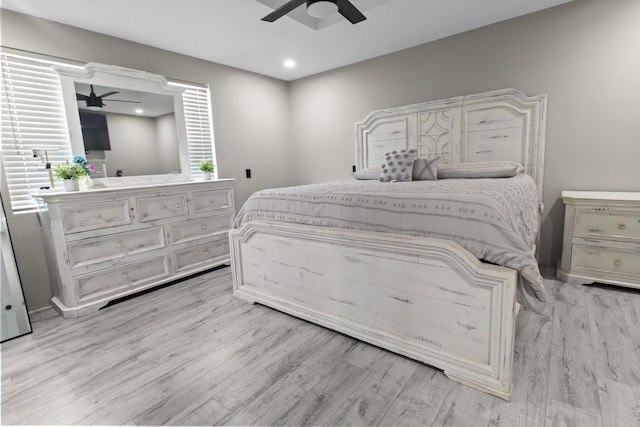 bedroom featuring light wood-type flooring and ceiling fan