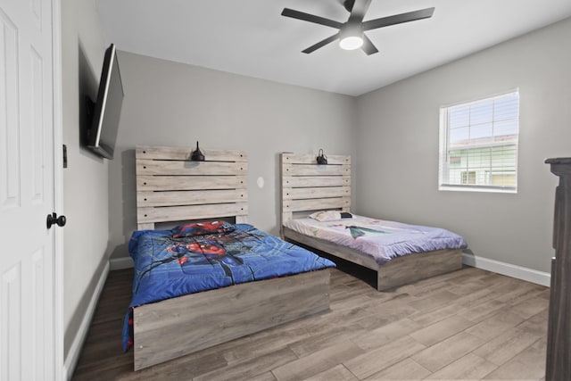 bedroom featuring ceiling fan and hardwood / wood-style floors