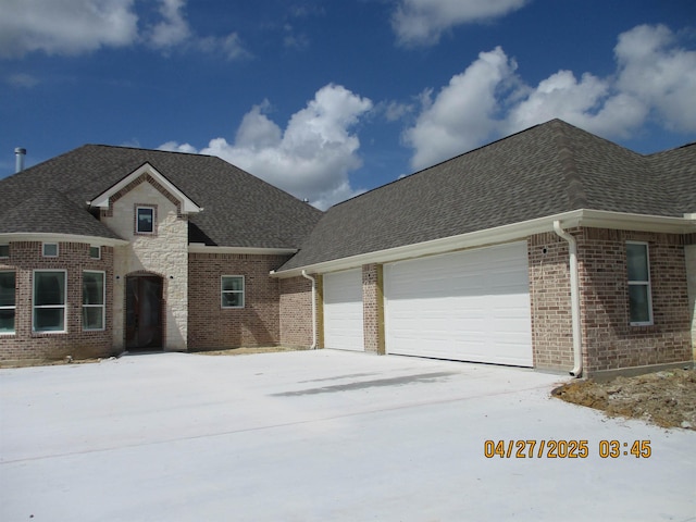 9250 Bellflower St, Beaumont, TX 77713 - view of front of home with concrete driveway, an attached garage, and roof with shingles