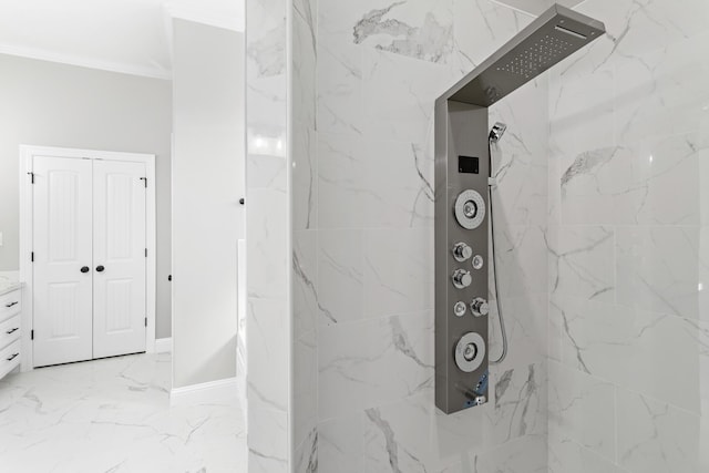 bathroom featuring a tile shower and ornamental molding