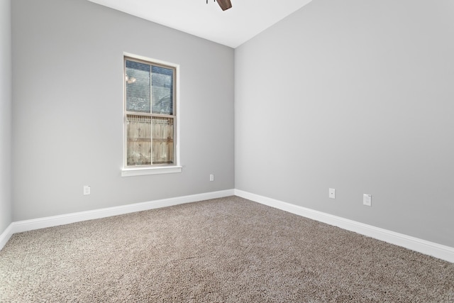 carpeted empty room featuring ceiling fan