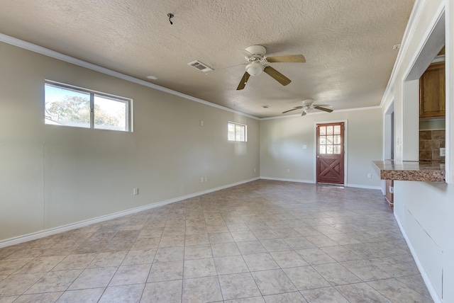 interior space featuring light tile patterned floors, a textured ceiling, ceiling fan, and ornamental molding