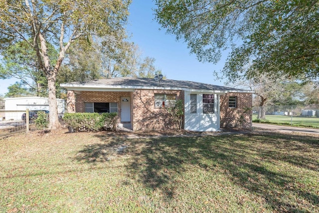 ranch-style house with a front lawn