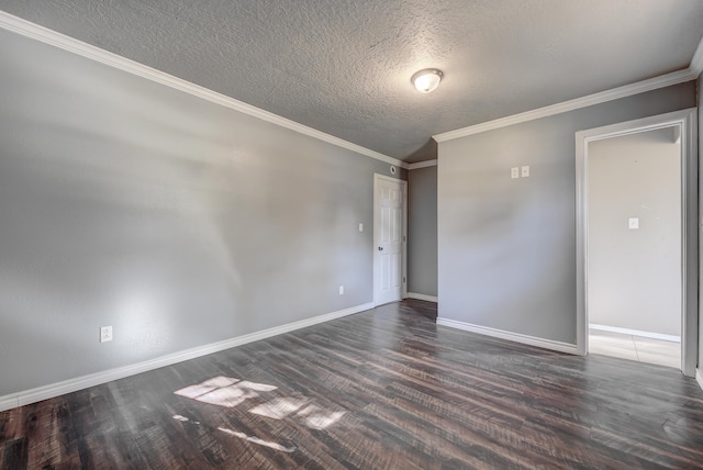 spare room featuring dark hardwood / wood-style flooring, a textured ceiling, and ornamental molding