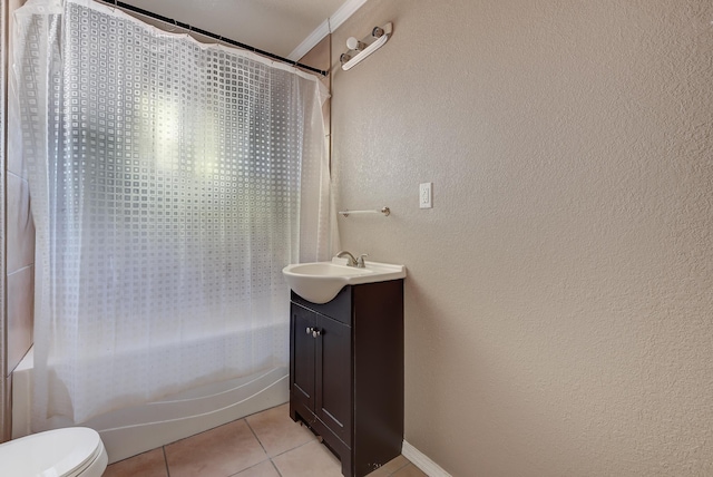 full bathroom featuring shower / bath combination with curtain, tile patterned floors, ornamental molding, vanity, and toilet