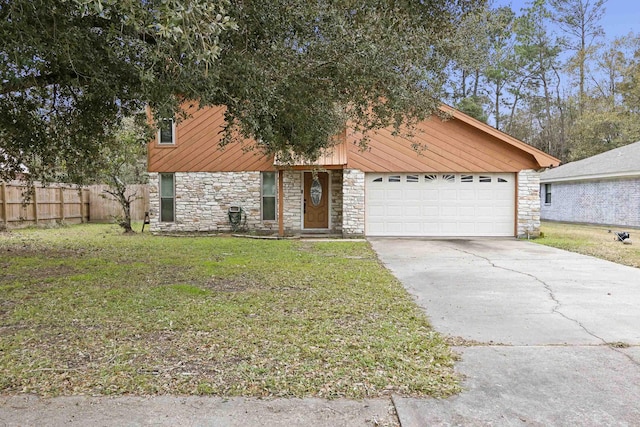 view of front of home featuring a garage and a front lawn