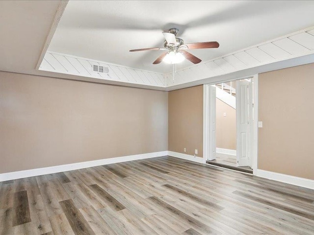 spare room with hardwood / wood-style flooring and ceiling fan