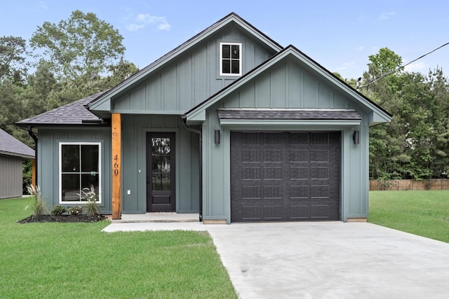 460 Myrtle, Silsbee, TX 77656 - view of front of property with a front yard, roof with shingles, board and batten siding, concrete driveway, and an attached garage