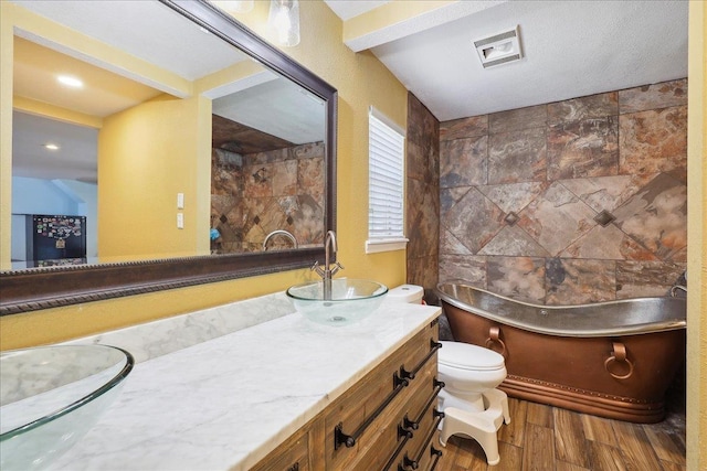 6006 Hazelwood Dr, Orange, TX 77632 - bathroom with vanity, hardwood / wood-style floors, and toilet