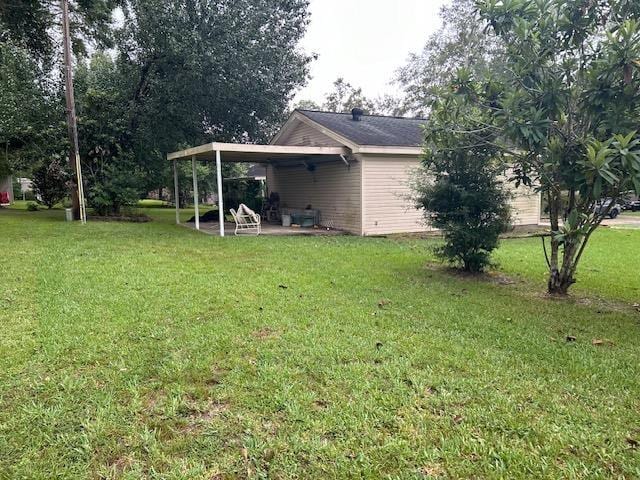 view of yard with a carport