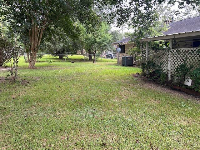 view of yard with central AC unit