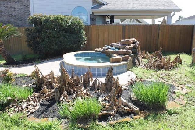 exterior details featuring a jacuzzi, cooling unit, and fence