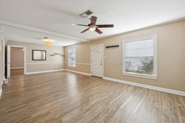 2342 Briarcliff Dr, Beaumont, TX 77706 - unfurnished living room featuring a ceiling fan, wood finished floors, and baseboards